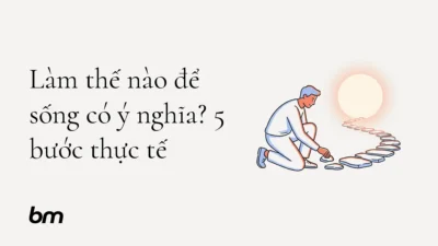 Minh họa cho Làm thế nào để sống có ý nghĩa? 5 bước thực tế: Một người đặt từng viên đá thành lối đi hướng về vòng tròn sáng, ẩn dụ cho việc tạo dựng ý nghĩa bằng những bước nhỏ và có chủ đích.