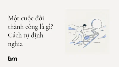 Minh họa cho Một cuộc đời thành công là gì? Cách tự định nghĩa: Một người tự đặt một viên gạch lên con đường riêng, hướng về vòng tròn mở tượng trưng cho cuộc sống do mình lựa chọn.
