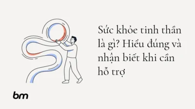 Minh họa cho Sức khỏe tinh thần là gì? Hiểu đúng và nhận biết khi cần hỗ trợ: Một người đứng cạnh đường nét tâm trí uốn lượn, nâng đỡ một vòng tròn đang chuyển động—ẩn dụ cho trạng thái tinh thần có thể thay đổi và cần được chăm sóc.